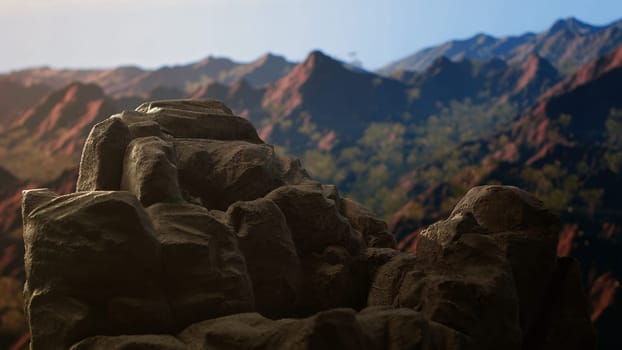 Panoramic view of a stunning mountain range with rocky terrain in the foreground. Perfect for adventure seekers looking for an extreme hiking experience in the heart of untouched wilderness.