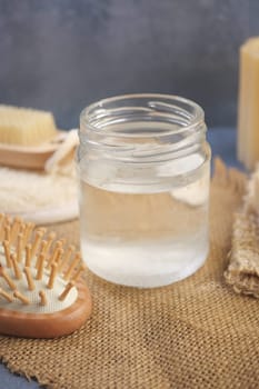 Natural coconut oil displayed on a rustic table setting,