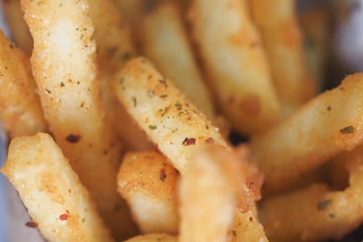 Deliciously fried potato sticks seasoned to perfection and ready to enjoy.