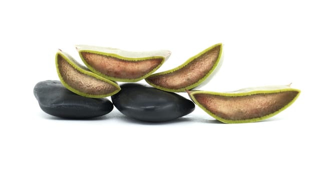 A detailed image of sliced fresh aloe vera next to smooth black stones, capturing a minimalist and balanced aesthetic that evokes peace and natural beauty