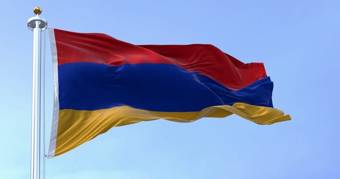 The national flag of Armenia waving in the wind on a clear day. Three horizontal bands in red, blue and apricot. 3d illustration render. Rippled textile