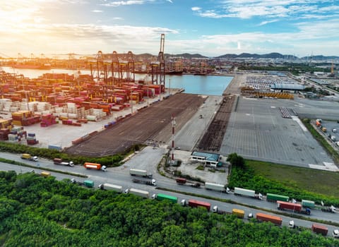 Logistics and transportation of container cargo ship at ship port. Container truck and crane bridge in shipyard. Import export and transport industry. Terminal port for export transport by ship.