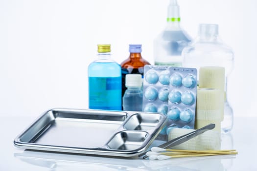 Medical equipment for treating infections. Wound care dressing set. Medical supplies for nurses. Conform bandage, forceps, cotton stick, alcohol. Sterile dressing materials. Healthcare equipment.