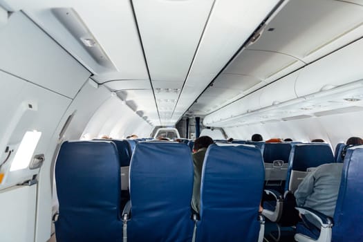 Passenger plane with people in flight ski