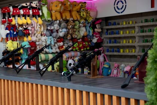 Toys and weapons in the shooting range