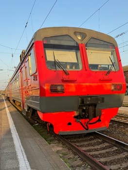 electric train at a stop on the railway