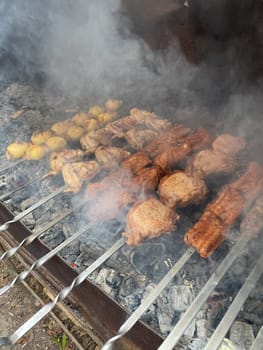 meat on skewers on fire kebabs