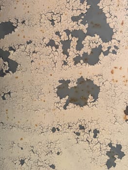 Old cracked beige wall as background