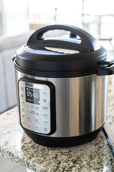 In a sleek modern kitchen, were adding an extra layer of flavor to succulent baby back ribs by infusing them with a medley of spices in a multicooker-a mouthwatering feast in the making.