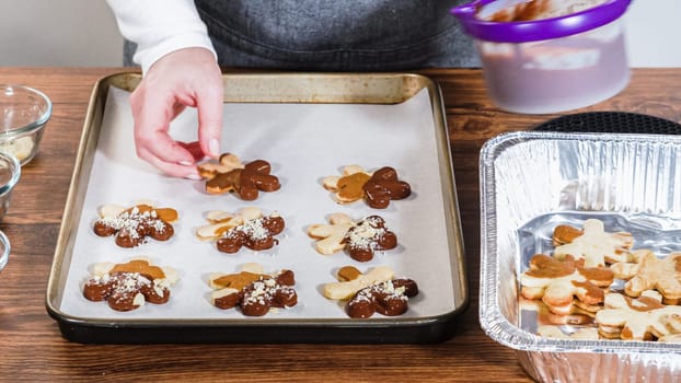 Crafting gingerbread cookie sandwiches with eggnog buttercream, presented on a rustic wooden table for Christmas gifting.