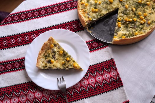 Traditional Ukrainian food on the table with embroidered tablecloth.