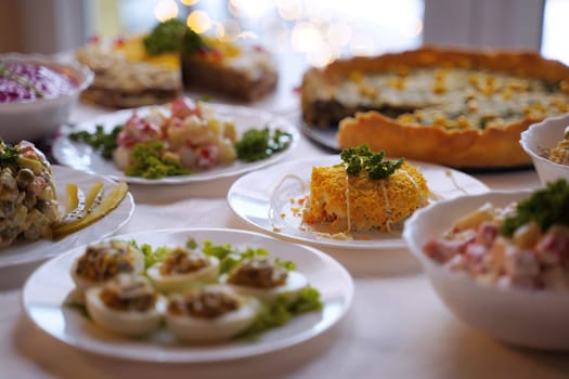 Traditional Ukrainian food on the table with embroidered tablecloth.