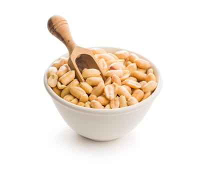 Roasted salted peanuts in bowl isolated on a white background.
