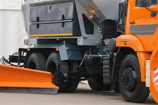 Orange scraper - part of truck constriction vehicle, close up