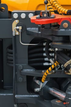 Part of tractor - mechanism of the bucket scraper, close up