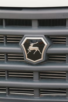 Kazan, Russia - October 28, 2017: Trademark logo deer on the hood of the small truck Gazel - Russian automotive industry, close up