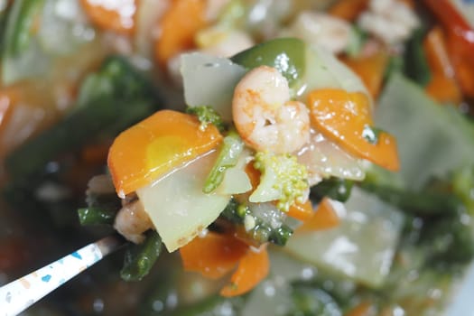 Colorful shrimp stir-fry with fresh veggies highlights nutritious ingredients.