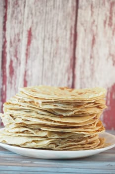 stack of chapati on a plate .