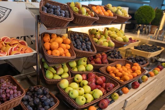 Lots of different ripe fruits on store shelves