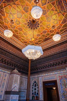 beautiful interior with painted wooden carved ceiling and walls in Museum of Art of Uzbekistan with Uzbek patterns and oriental ornaments in palace in Tashkent