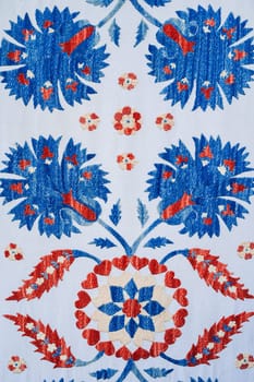 traditional Uzbek geometric pattern on an ancient carpet in Uzbekistan. Oriental white background with beautiful ornaments