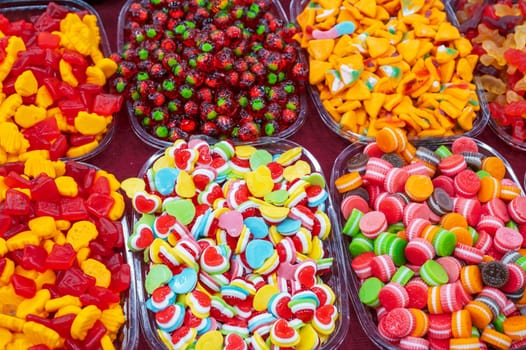 colorful marmalade and chewable candies on counter at a candy store in the oriental market