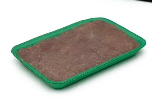Freshly packaged ground meat sits in a bright green tray, ready to be transformed into savory dishes. Perfect for grilling or sauteing for any culinary creation.