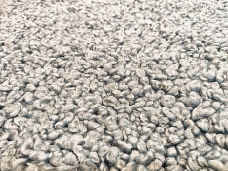 Close-up view of a soft, textured carpet showcasing a unique pattern, suited for warmth and style in home and office environments.