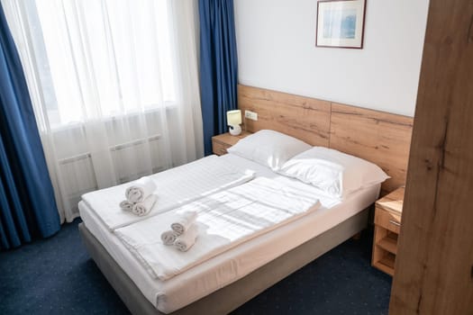 A modern and serene hotel room in a medical rehabilitation facility, designed for comfort and relaxation, offering a peaceful environment for patients to recover and rejuvenate.