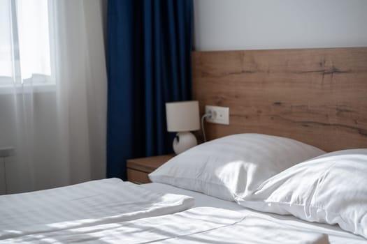 A modern and serene hotel room in a medical rehabilitation facility, designed for comfort and relaxation, offering a peaceful environment for patients to recover and rejuvenate.