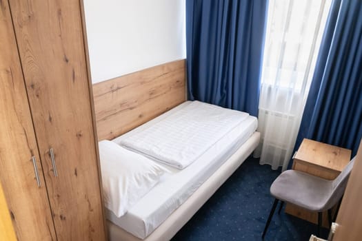 A modern and serene hotel room in a medical rehabilitation facility, designed for comfort and relaxation, offering a peaceful environment for patients to recover and rejuvenate.