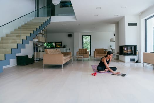 Young Beautiful Female Woman with Trainer via Video Call Conference in Bright Sunny House. Healthy Lifestyle, Wellbeing and Mindfulness Concept.
