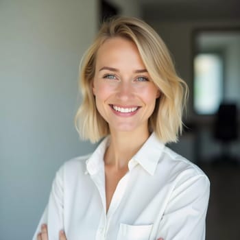 A cheerful blonde woman in a white shirt smiles warmly as she serves clients in a contemporary bank office filled with natural light.