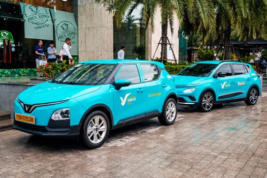 Blue Vietnamese electric cars Vinfast taxi on the street in Vietnam. Nha Trang, Vietnam - April 01, 2025