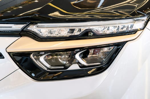 front headlight on hood of luxury modern Vietnamese electric car close-up