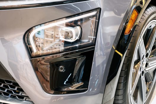 front headlight on the hood of a modern Vietnamese electric car close-up
