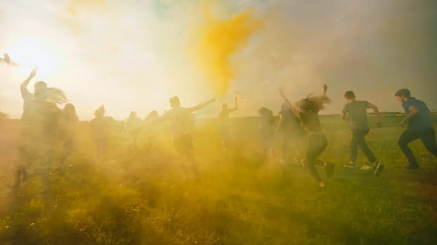Happy friends girls waving colorful smoke at sunset