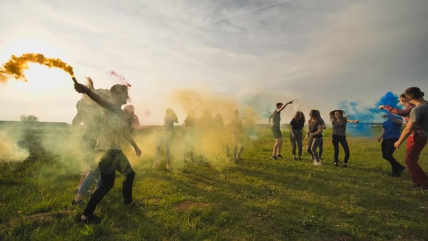Happy friendly friends are running with toy planes that emit colored smoke