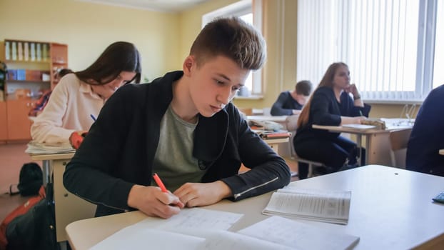 Schoolchild in class busy with work. Russian school