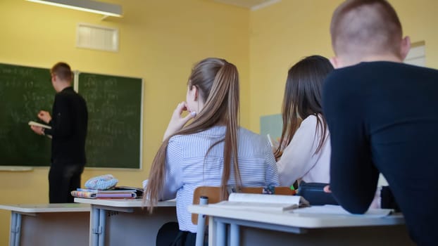 Students in the class are busy with work