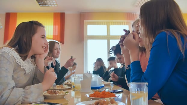 Students eat in the school cafeteria