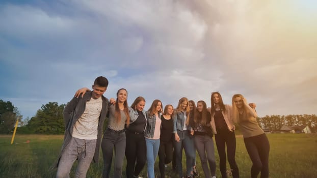 Group of friendly school friends at sunset