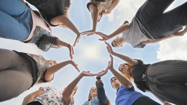 Conceptual symbol of cooperation diverse hands making a circle. Students help each other