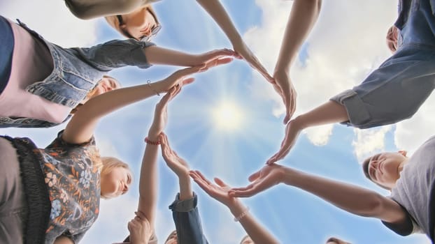 Conceptual symbol of cooperation diverse hands making a circle. Students help each other