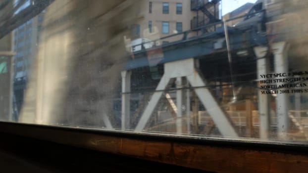 New York City, United States - 14 Sept 2023: Subway train, Manhattan bridge. Shaking camera, dirty window. Downtown metro transport, metropolitan traffic. Passenger elevated railway, United States.