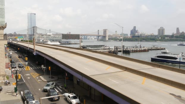 New York City, United States - 30 Aug 2023: Waterfront road, Manhattan Downtown financial district riverfront from Elevated Acre. Highway along East river, cars on waterside FDR drive. Brooklyn Bridge