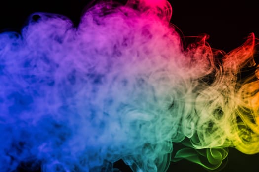 colorful smoke on dark background. artistic colorful background