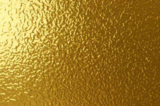gold foil background with light reflections. golden textured abstract background