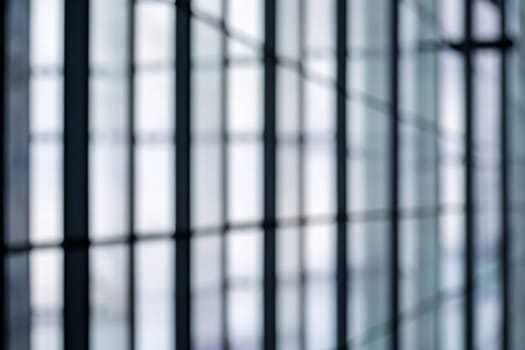 blurred abstract grey glass wall from building background. abstract architectural theme