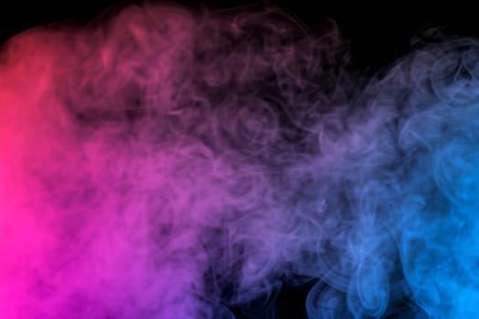 colorful smoke on dark background. artistic colorful background